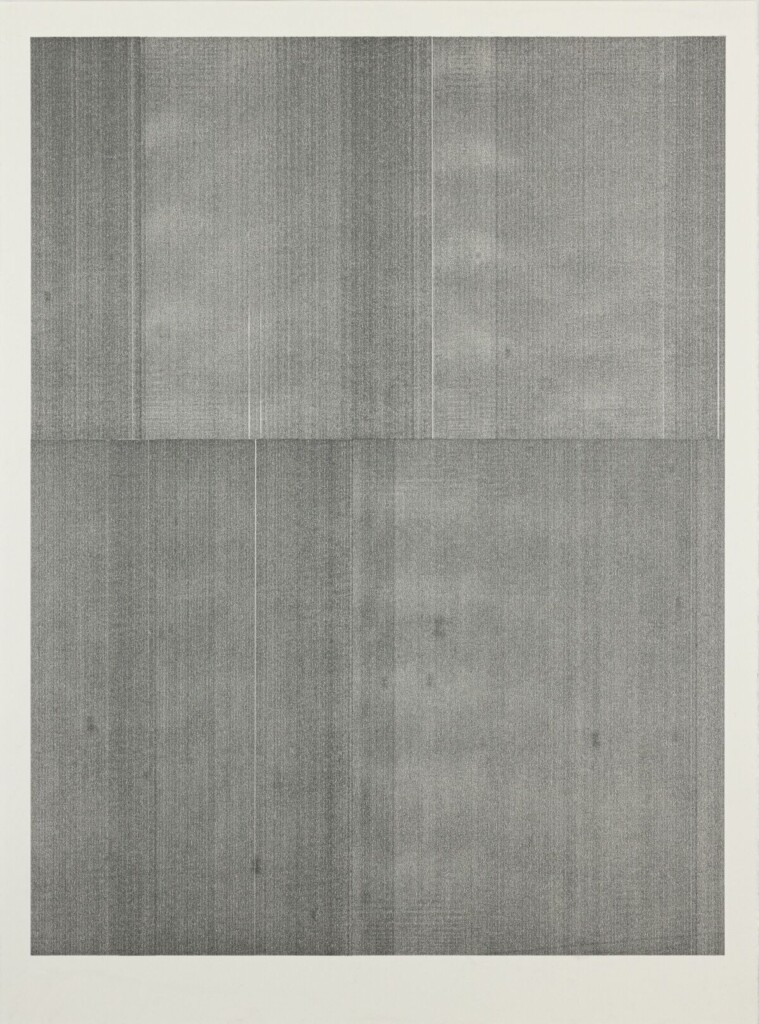 A photo of a piece of vertical-orientation paper covered in columns of graphite