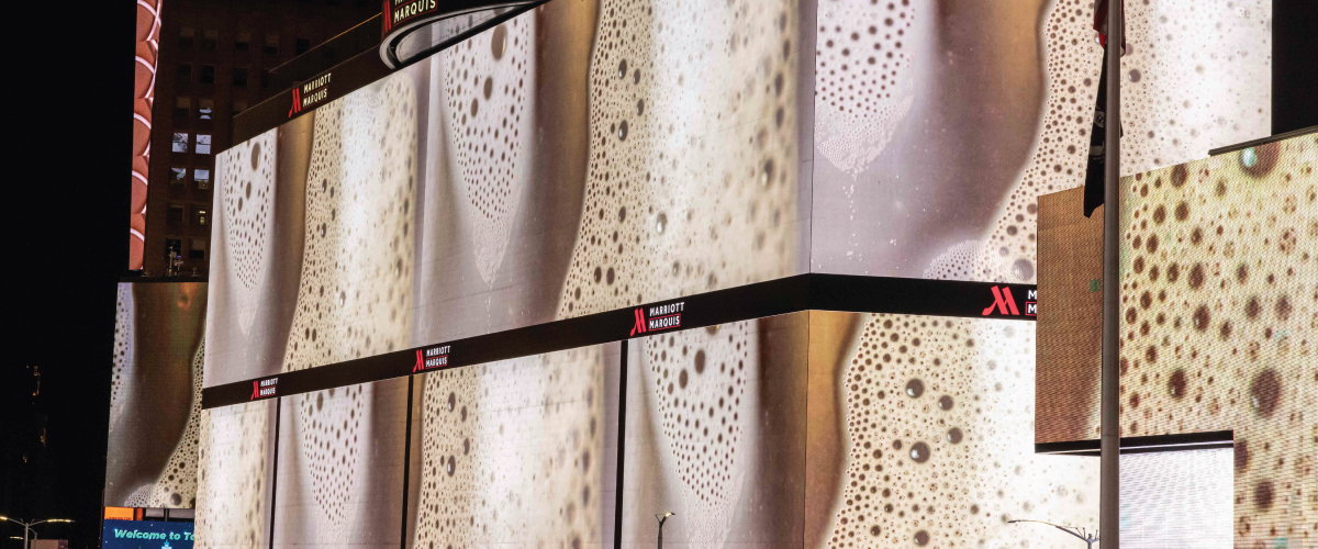 Images of bubbly white fluid fill large digital billboards