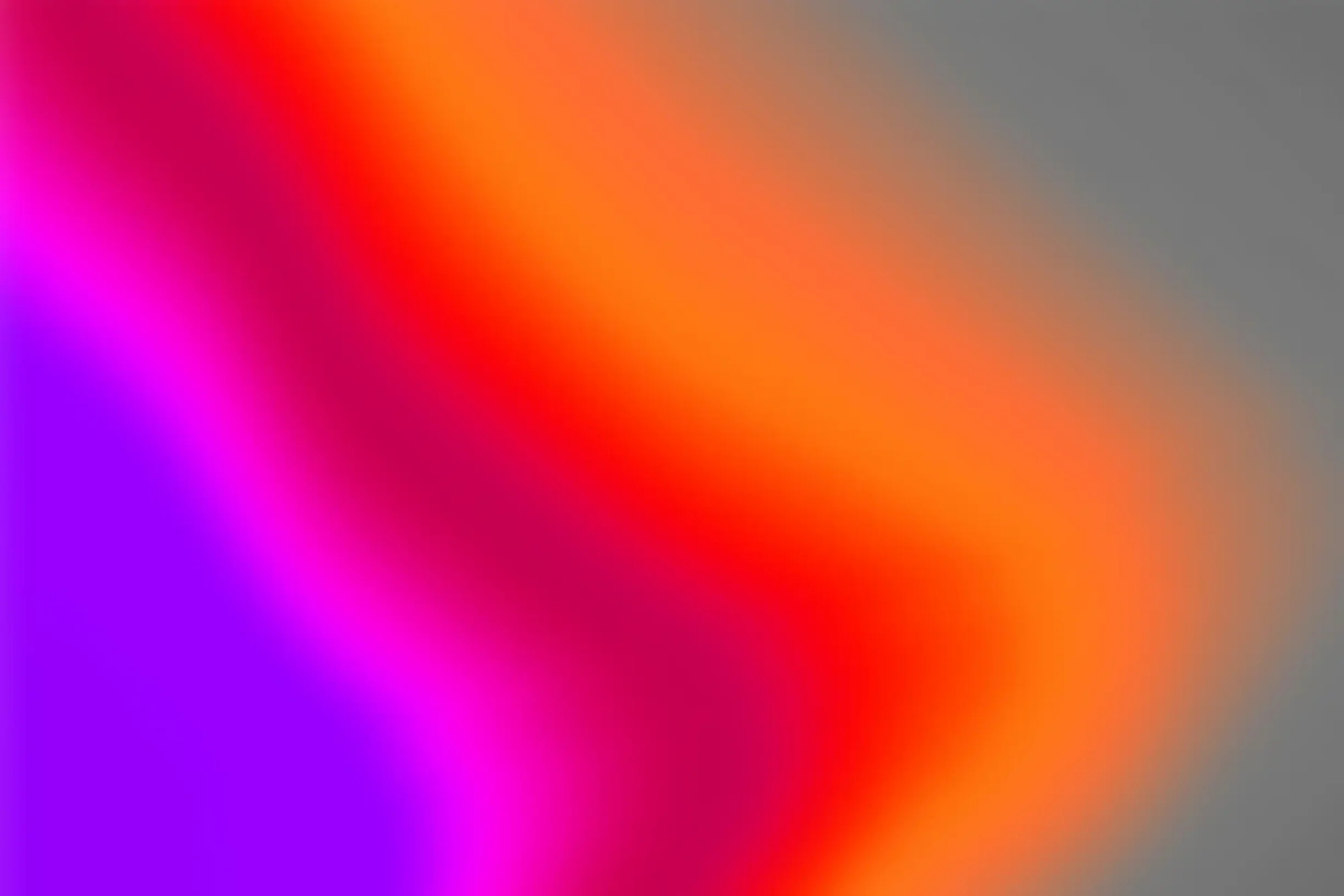 A soft gradient passing through sahdes of blue, violet, red, and orange